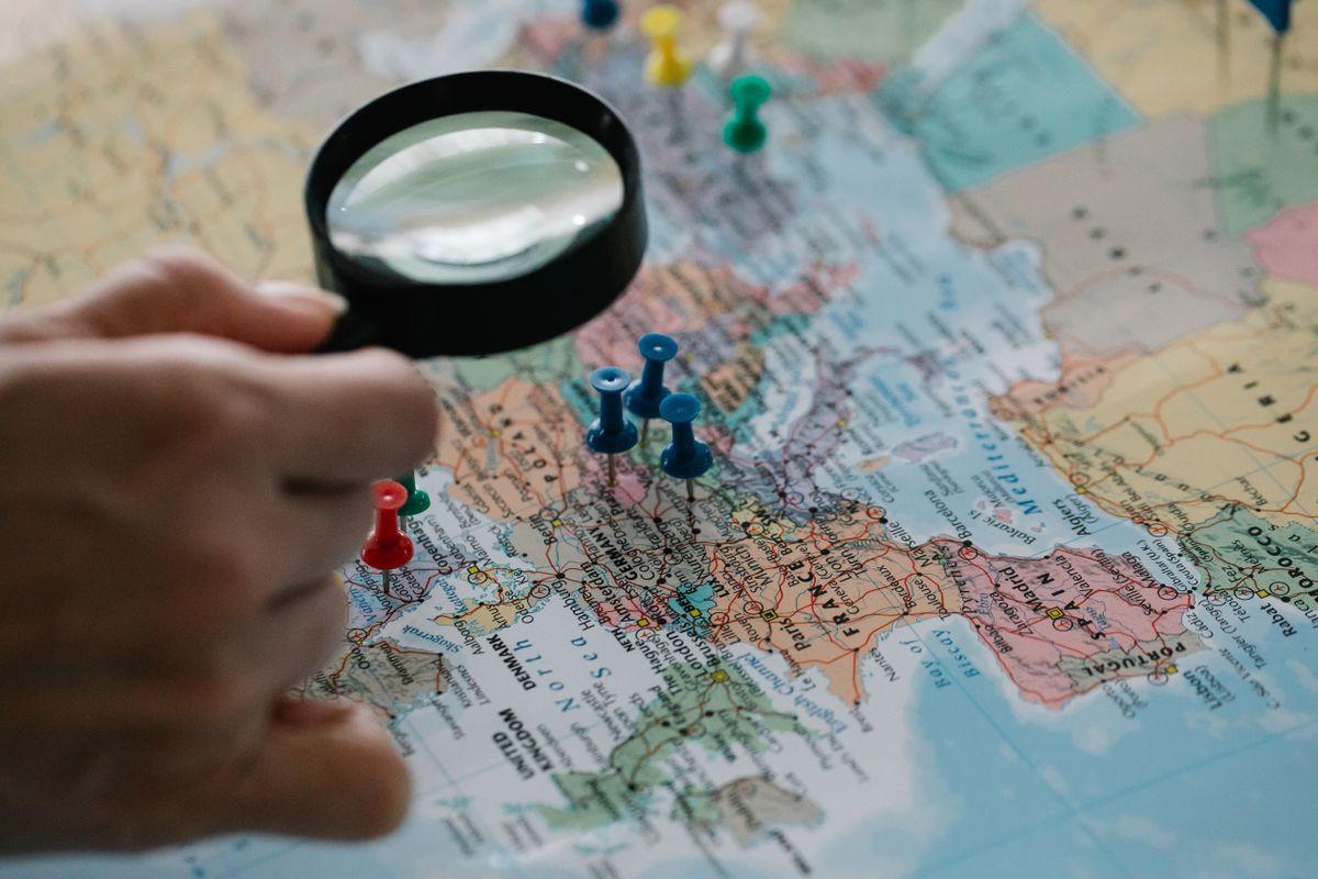 Magnifying glass highlighting multiple business locations on a map