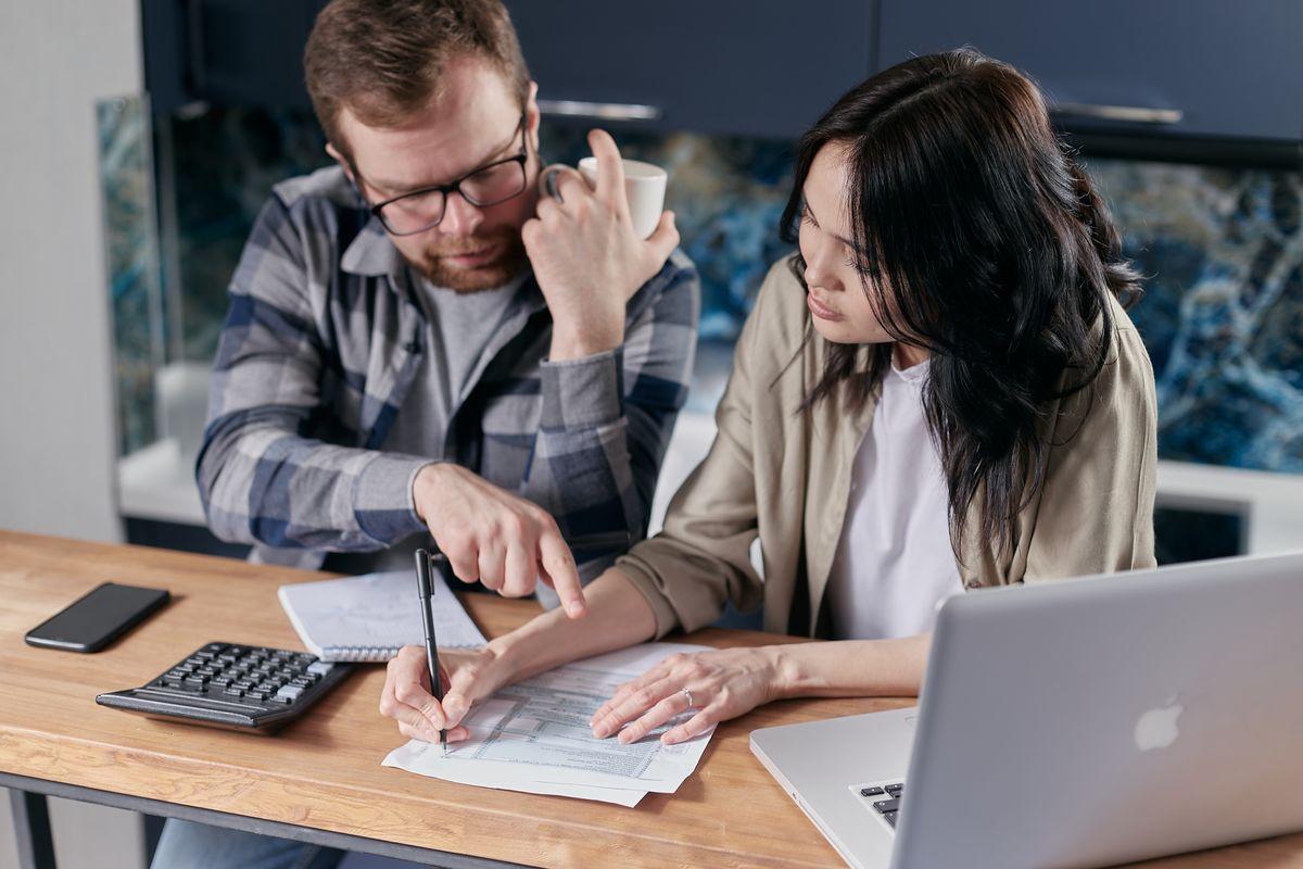 Business owners analyzing a custom marketing quote