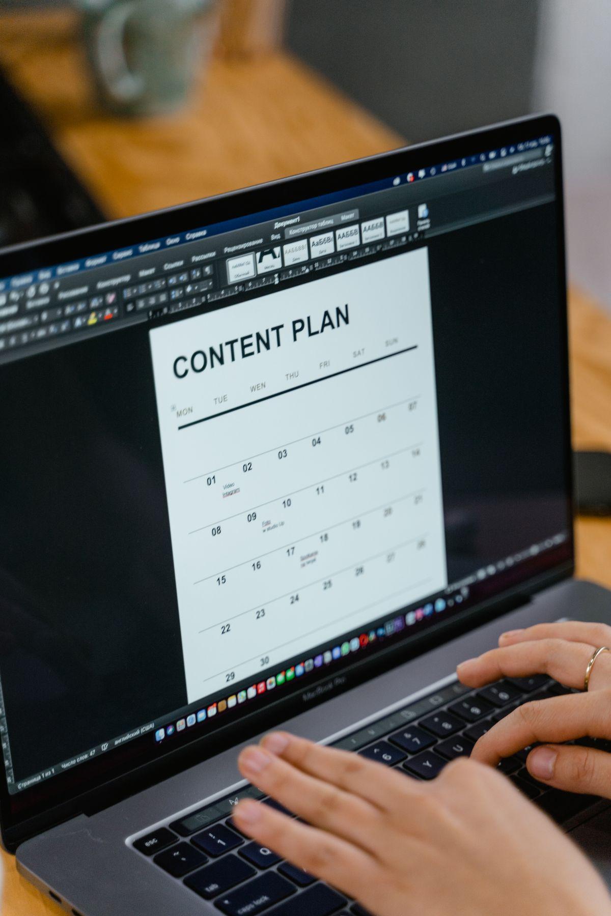 Writing a content marketing plan on a laptop